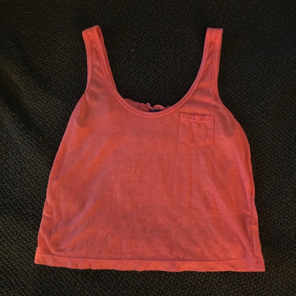 Peach color tank top with see through lace back.